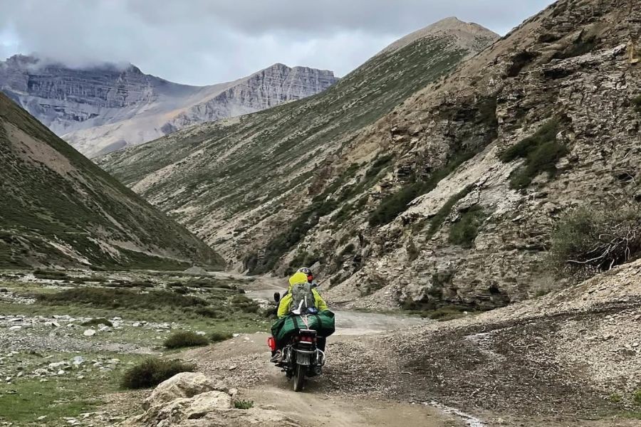 Motorcycle rider on a mountain road